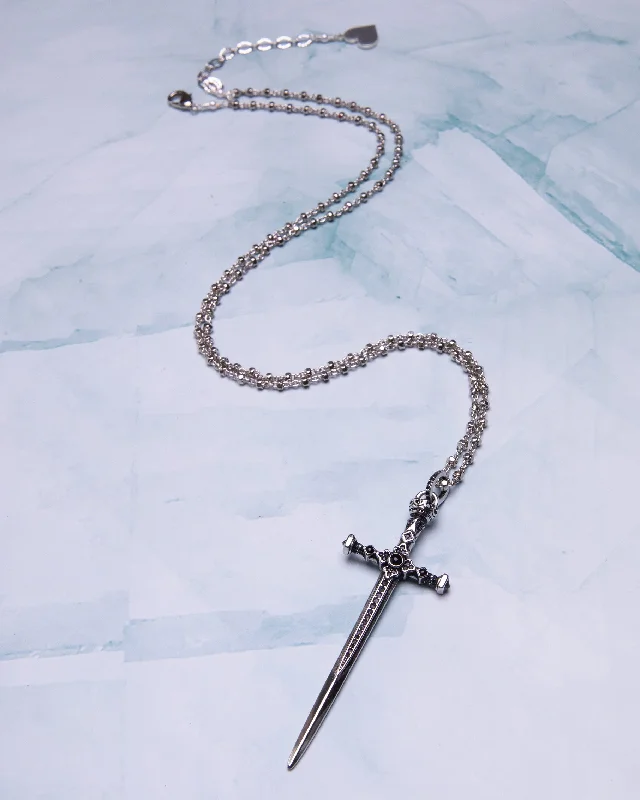 Elevate Your Outfit With Discounted Statement Jewelry Dagger Cross Necklace