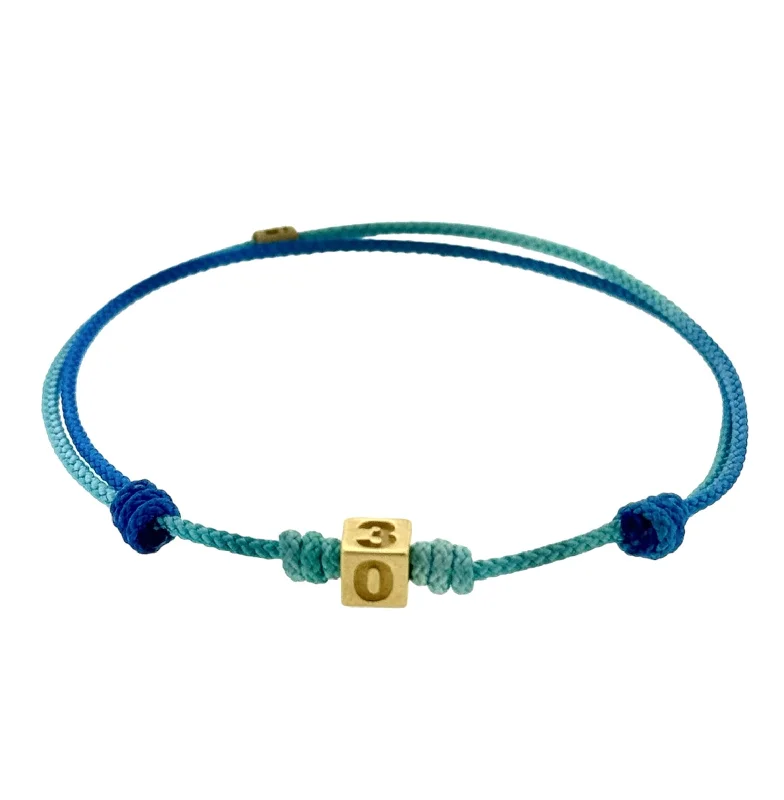Huge Savings On Timeless Jewelry Collections 305 Area Code Gold Cube with Sapphire on Cord Bracelet Huge Savings On Timeless Jewelry Collections 305 Area Code Gold Cube with Sapphire on Cord Bracelet
